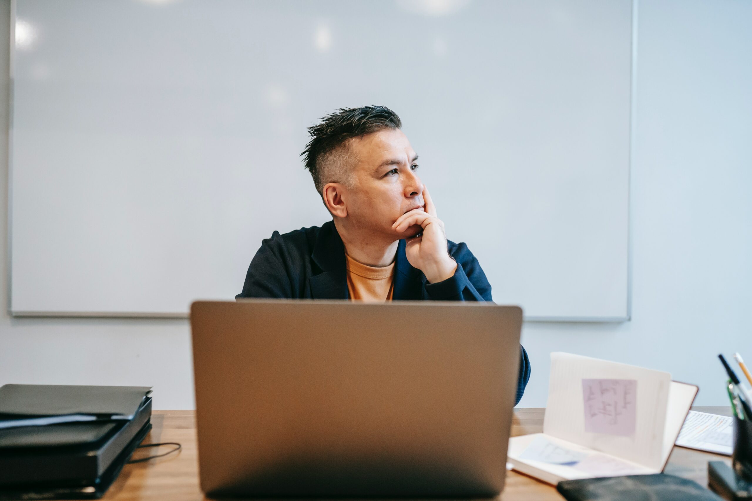 man-daydreaming-in-front-of-laptop