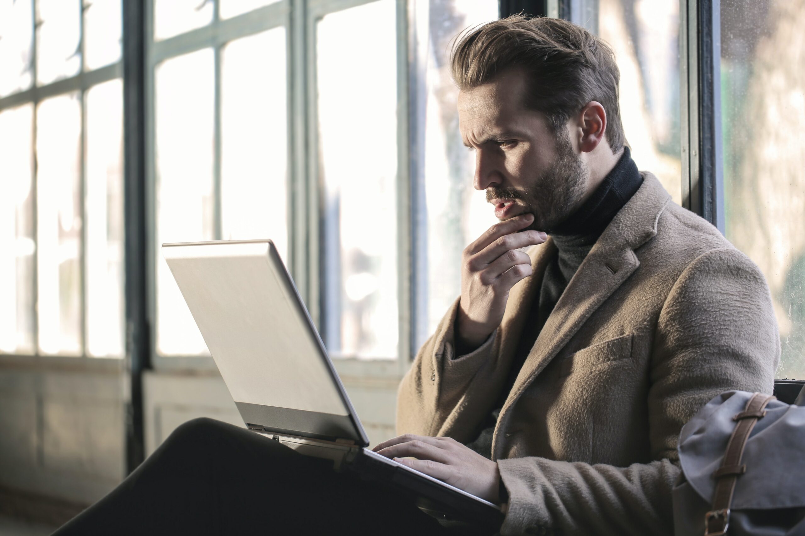 man-looking-at-laptop-seriously